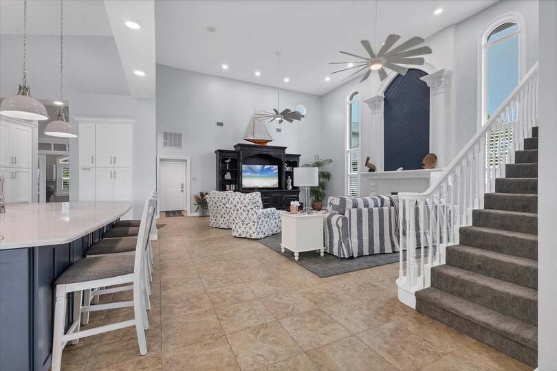Large, open living space with ample seating, fireplace and 70-inch Smart TV