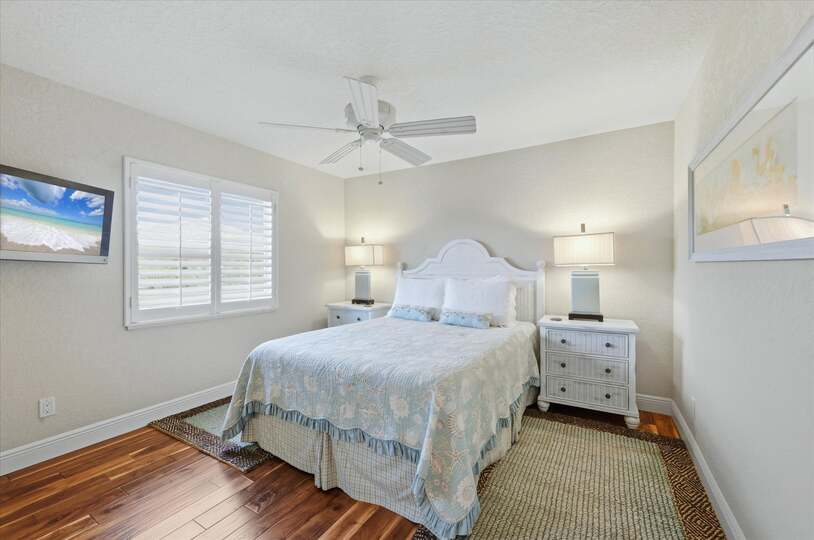 Guest bedroom 1 with queen bed and 32-inch Smart TV