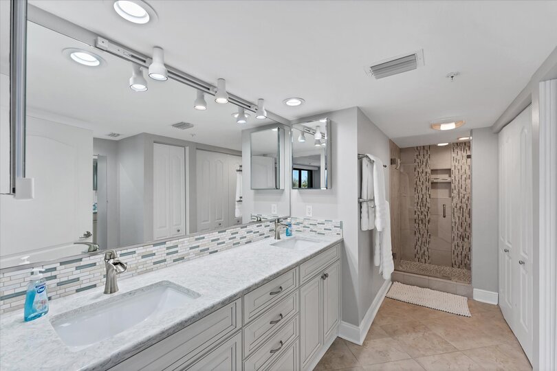 Primary Bathroom With Double Vanities and Walk-In Shower