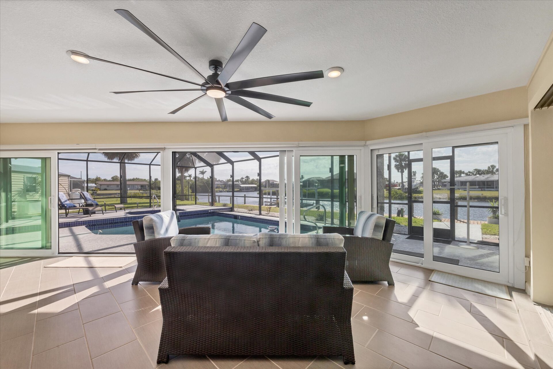 Covered lanai overlooking the pool and canal