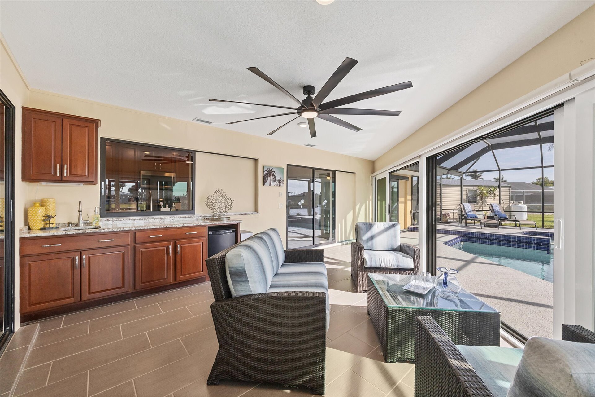 Covered lanai overlooking the pool and canal