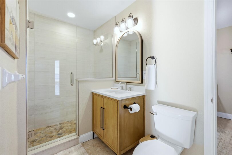 Downstairs guest bathroom 2 (attached to bedroom 4) with walk-in shower, and lanai access