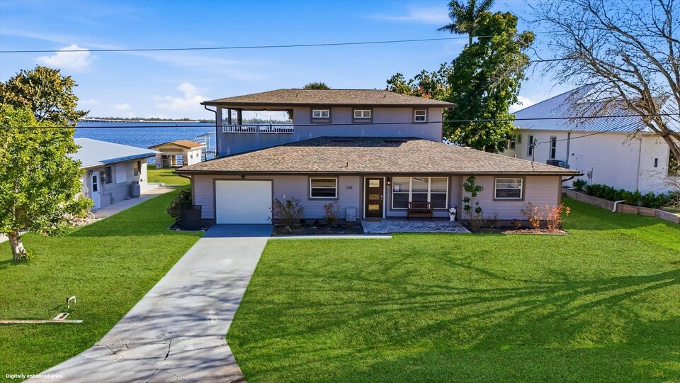 Gorgeous 4 bedroom, 3 bathroom, 2 story waterfront home with private pool on Peace River in Punta Gorda, FL
