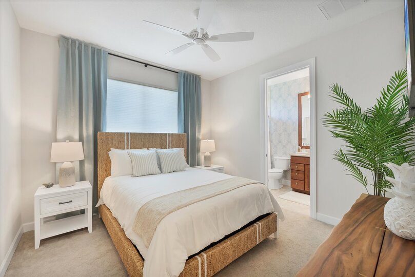 Guest bedroom 3 with queen bed, attached bathroom, and 43-inch Smart TV