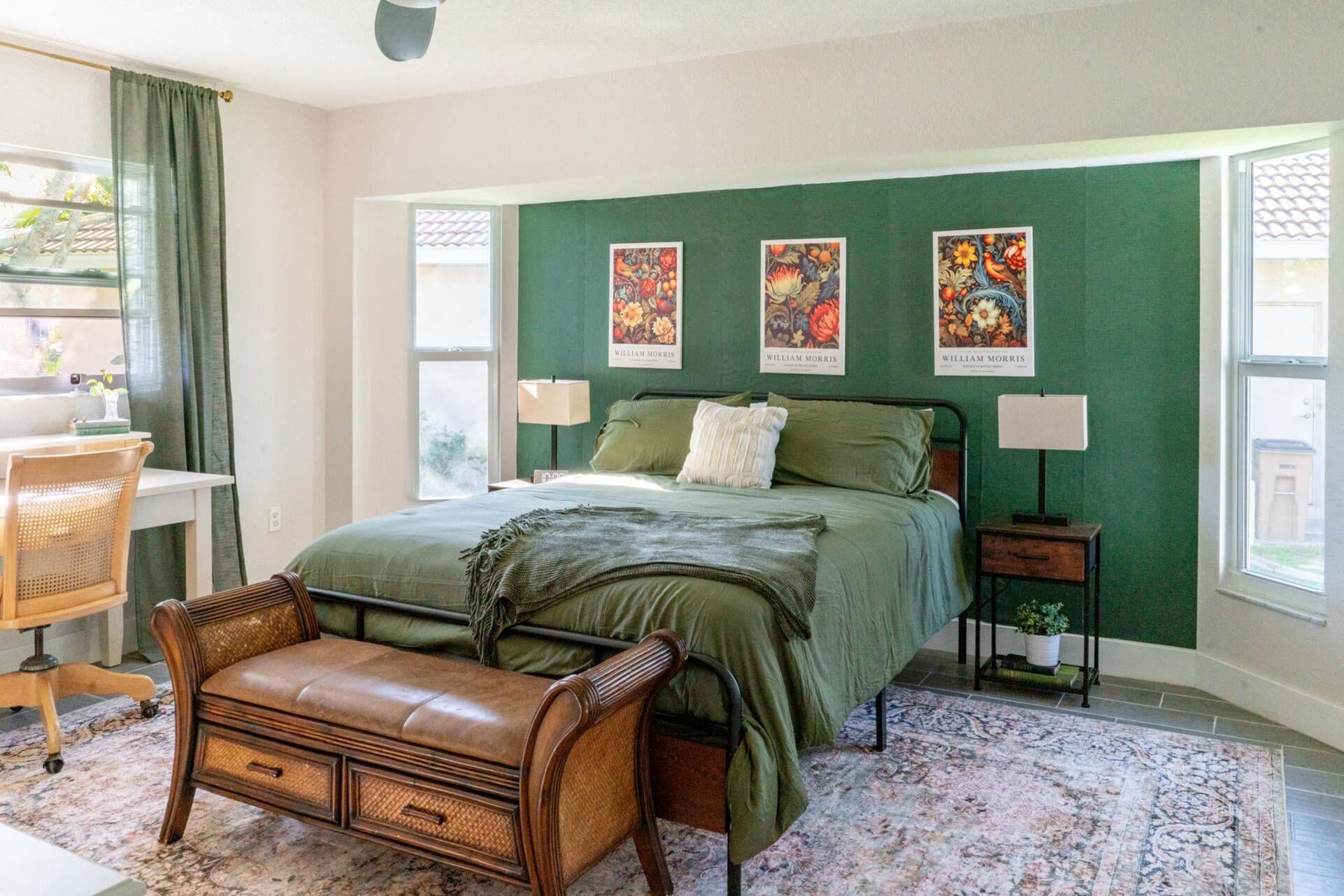 Primary bedroom featuring a queen bed and attached bathroom