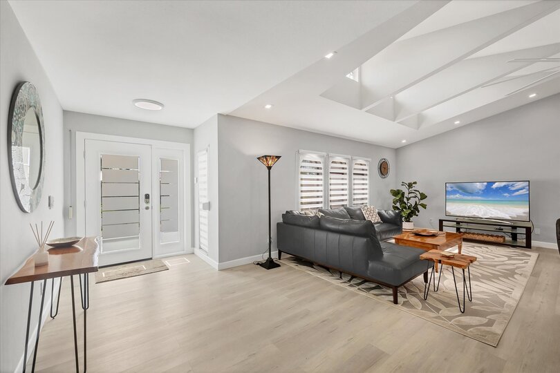 Large, Open, and Bright Living Area with 65" Smart TV