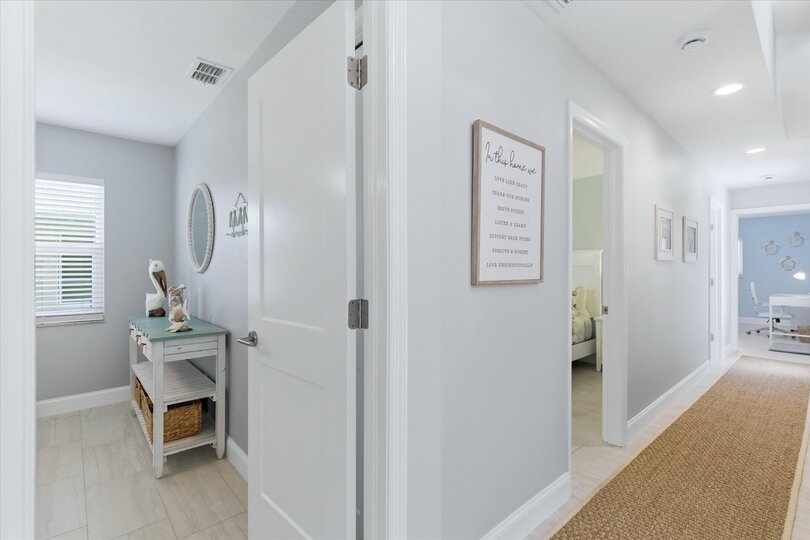 Hall leading to 3 bedrooms
